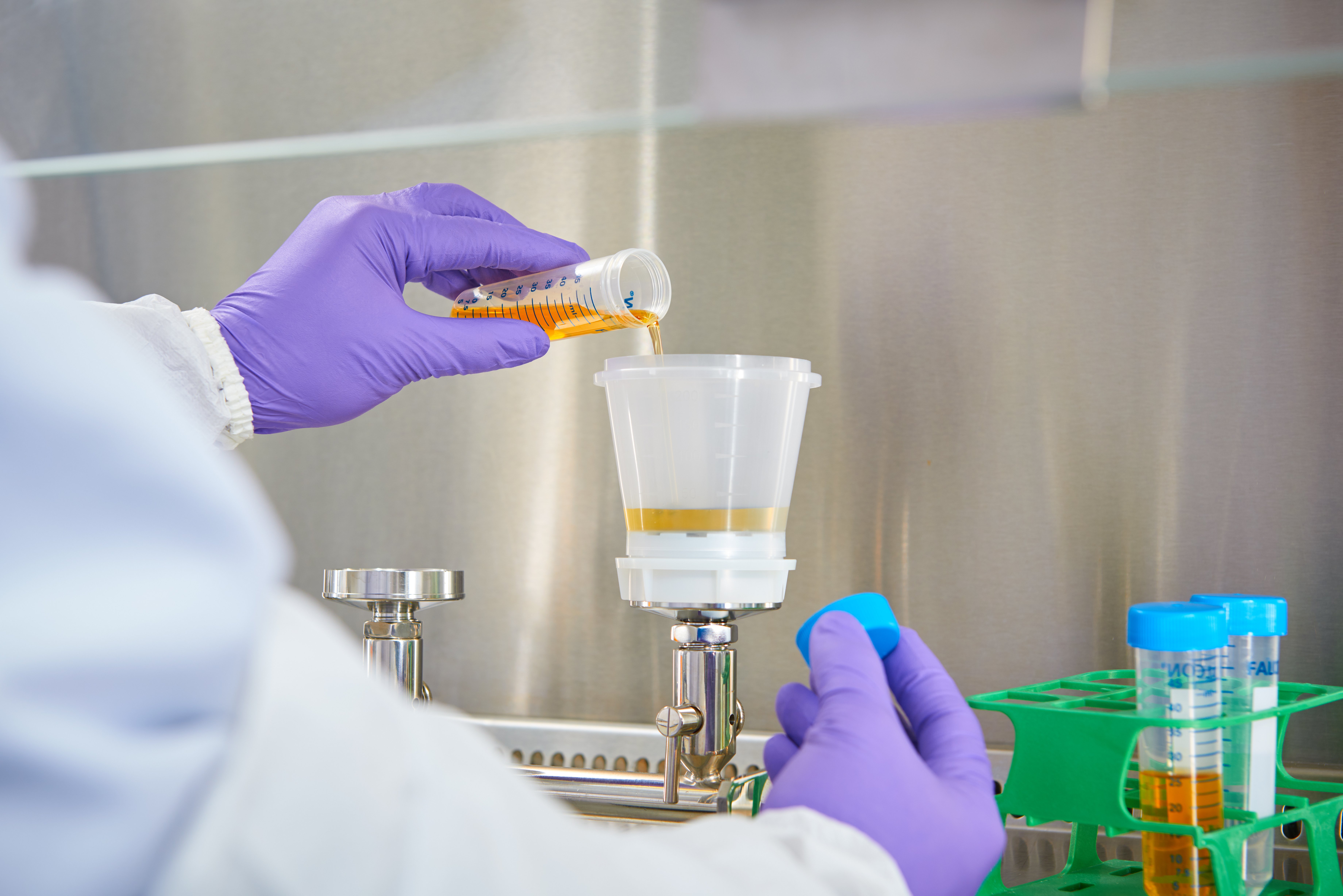 Quality Control Bioburden Testing in a hood in laboratory for product testing.