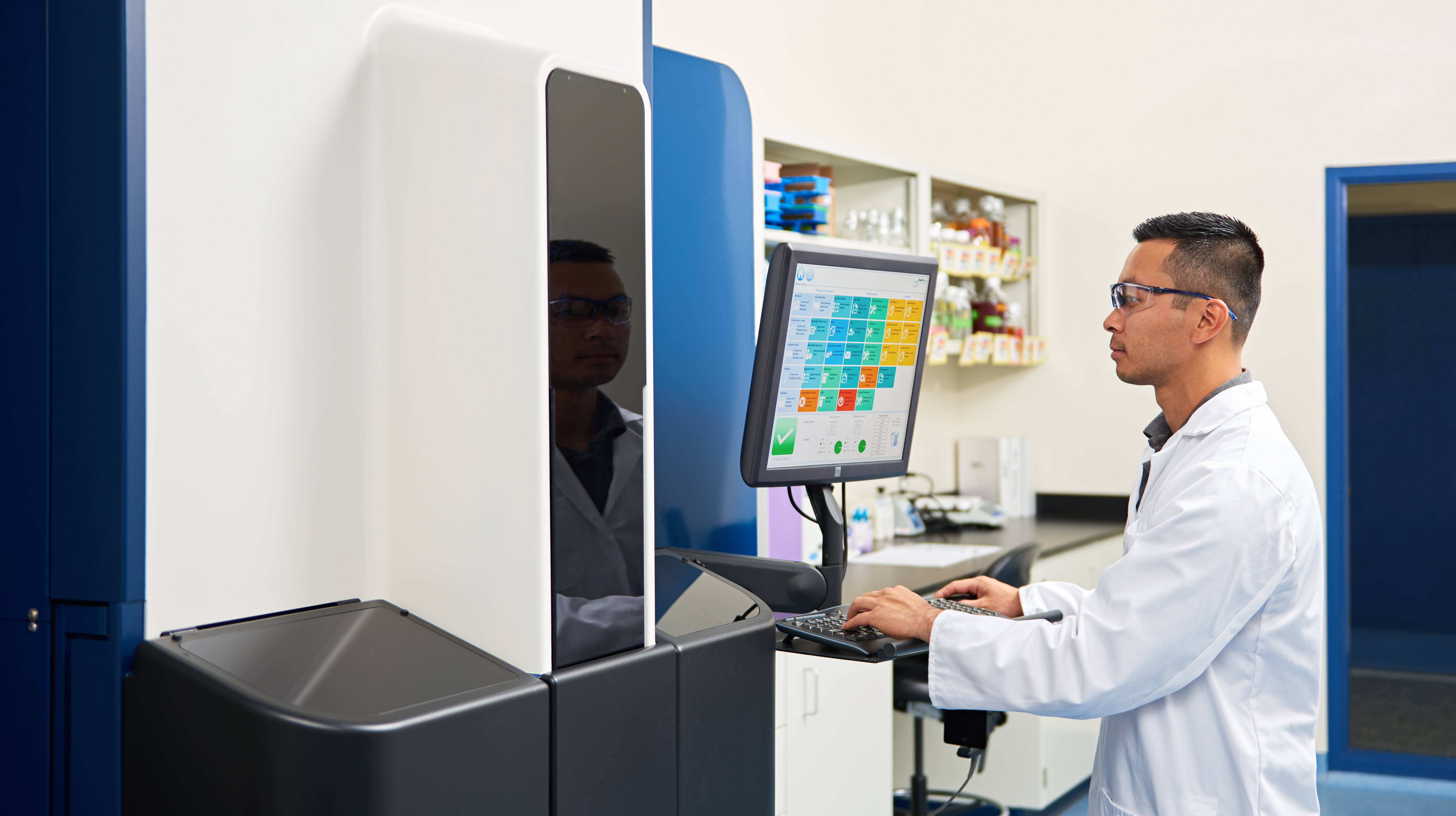 Technician using Growth Direct® System for automated QC microbiology testing.